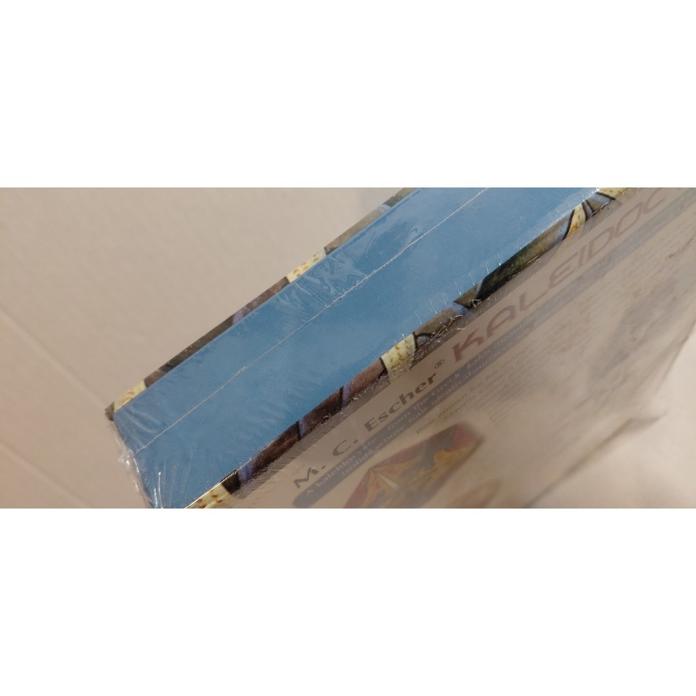 Pomegranate M.C. Escher Kaleidocycles by Doris Schattschneider & Wallace Walker. - Picture 8 of 15